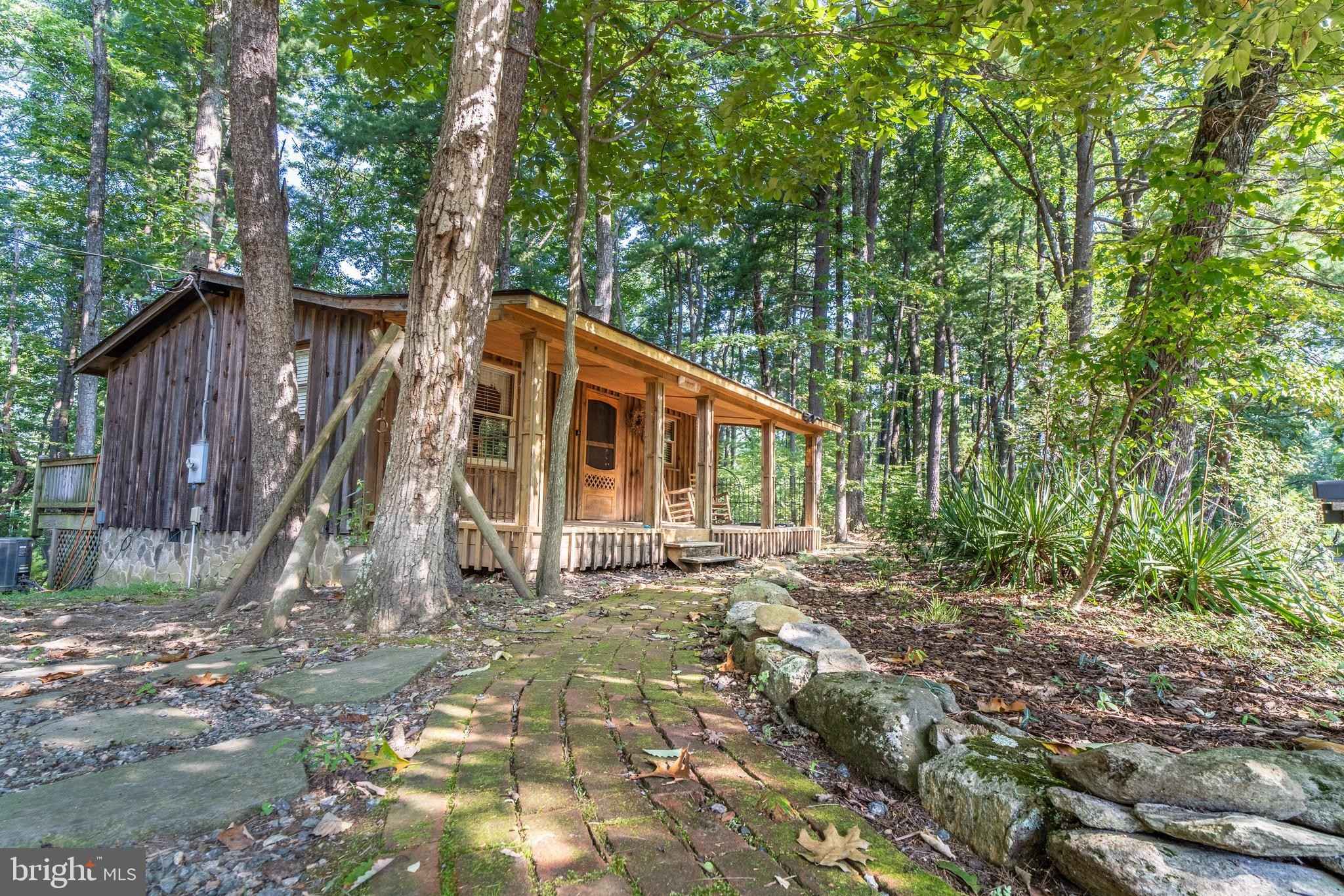 Circa 1981 Rustic Cottage For Sale W/Outbuildings on 6.8 Secluded Acres