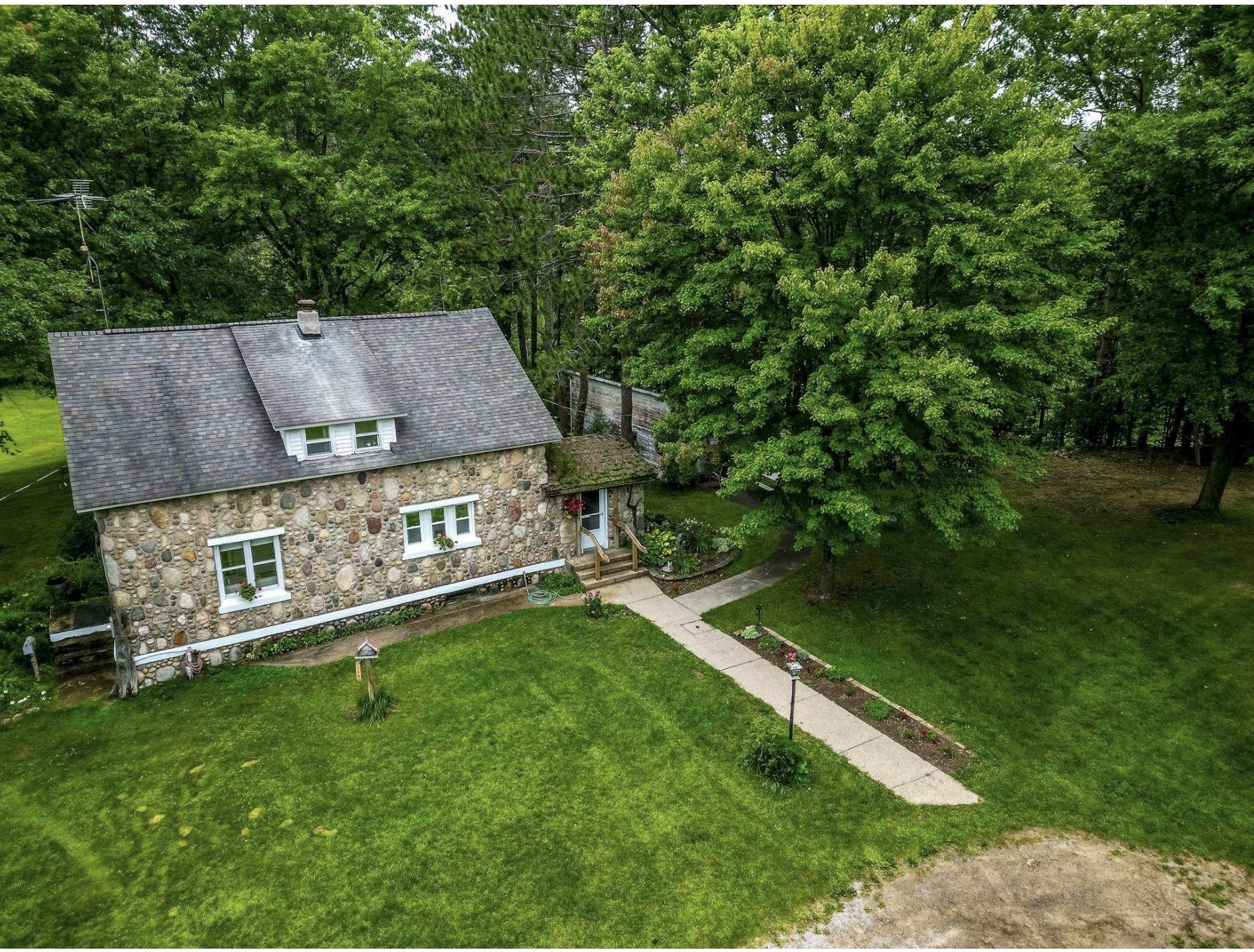 circa-1935-stone-cottage-for-sale-with-garage-barn-outbuildings-and